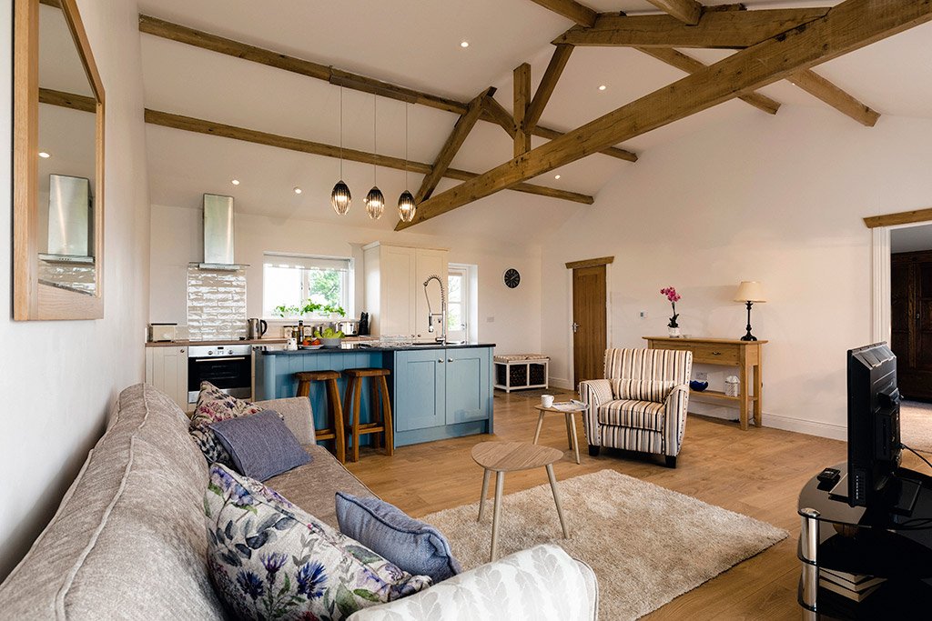 Modern living room with exposed wooden beams.