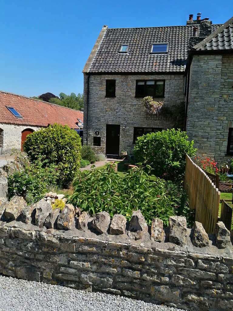 Stone house barn conversion with garden and stone wall