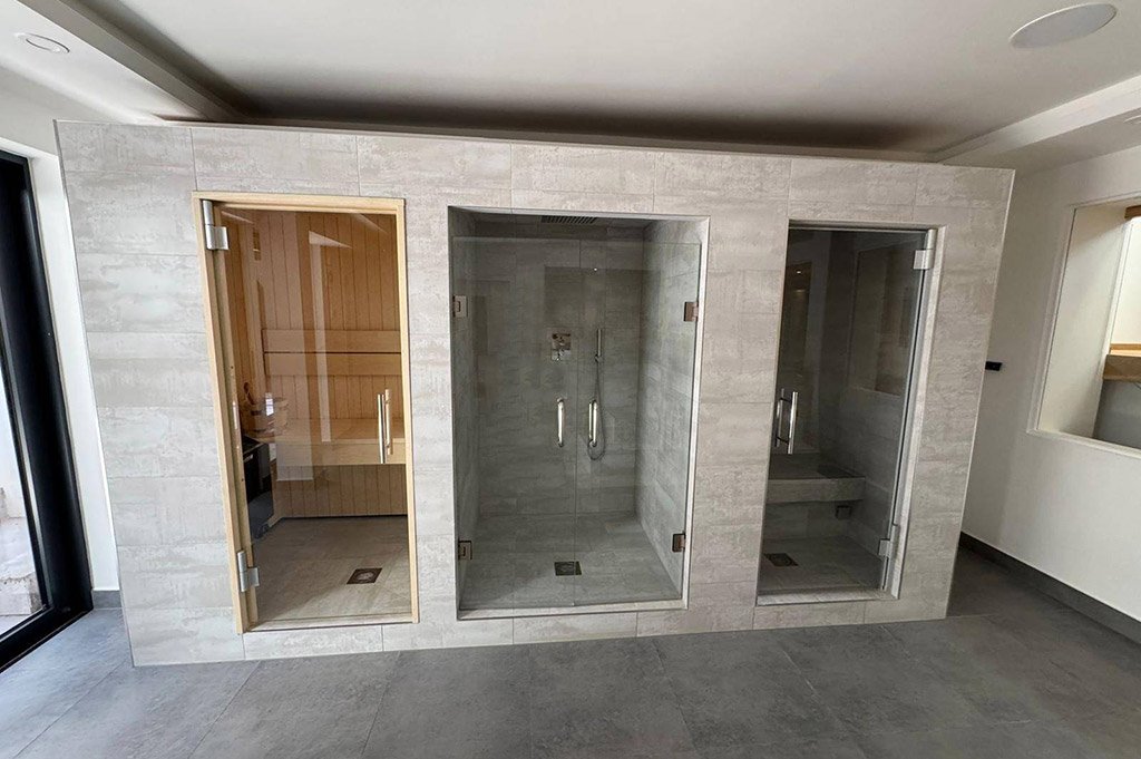 Three modern sauna and steam rooms in basement new build